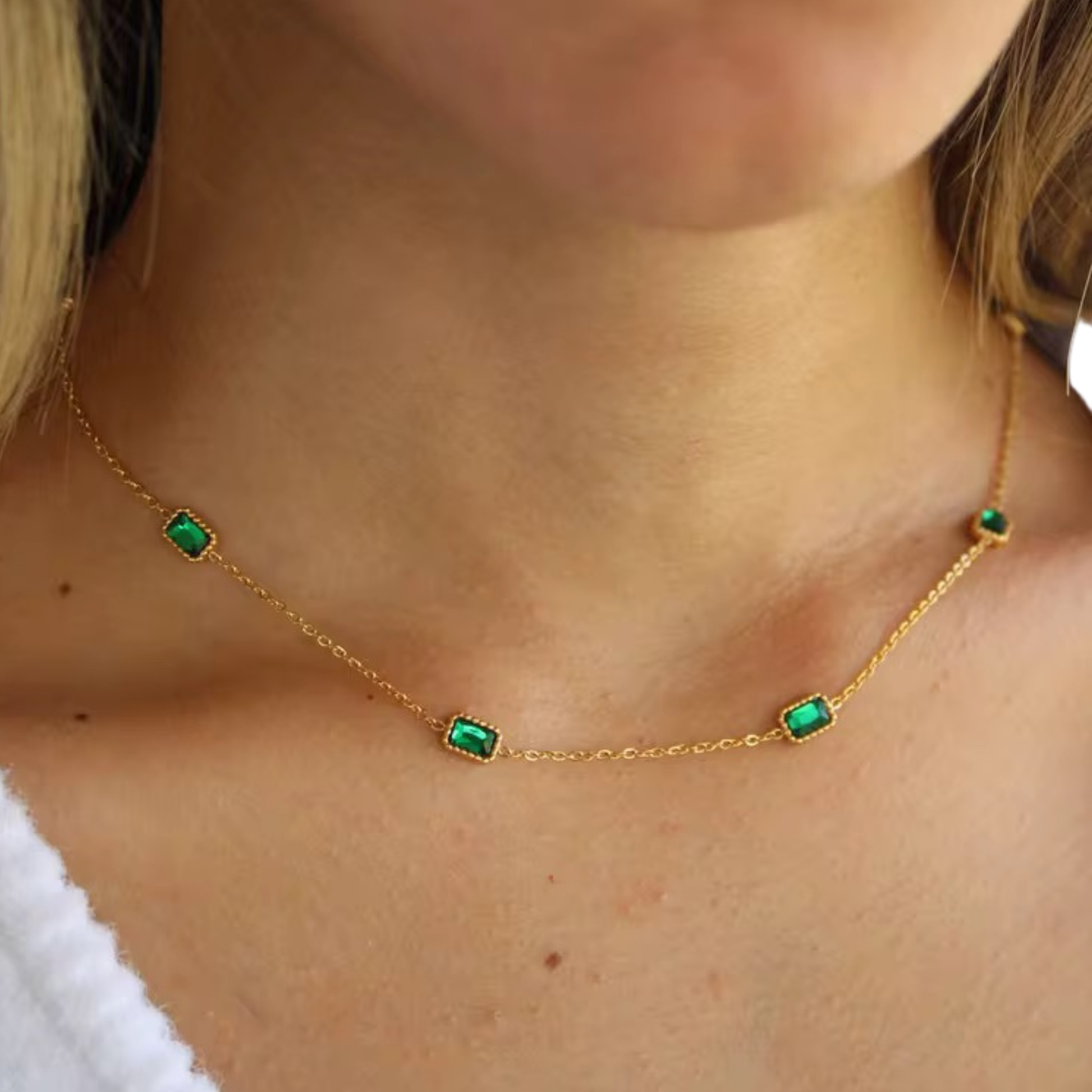 Emerald Muse Necklace crafted from stainless steel with 18K gold plating and emerald-inspired crystals, designed for elegant everyday wear.